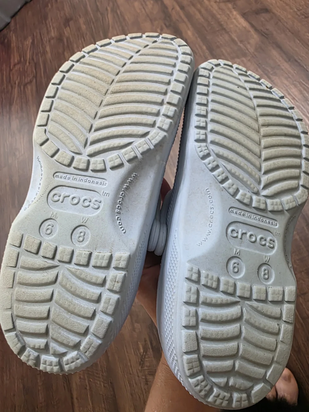 Crocs Classic Clog in a light blue color, size M6 / W8. Includes assorted decora